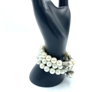 Three bracelets with Faux pearls and silver charms